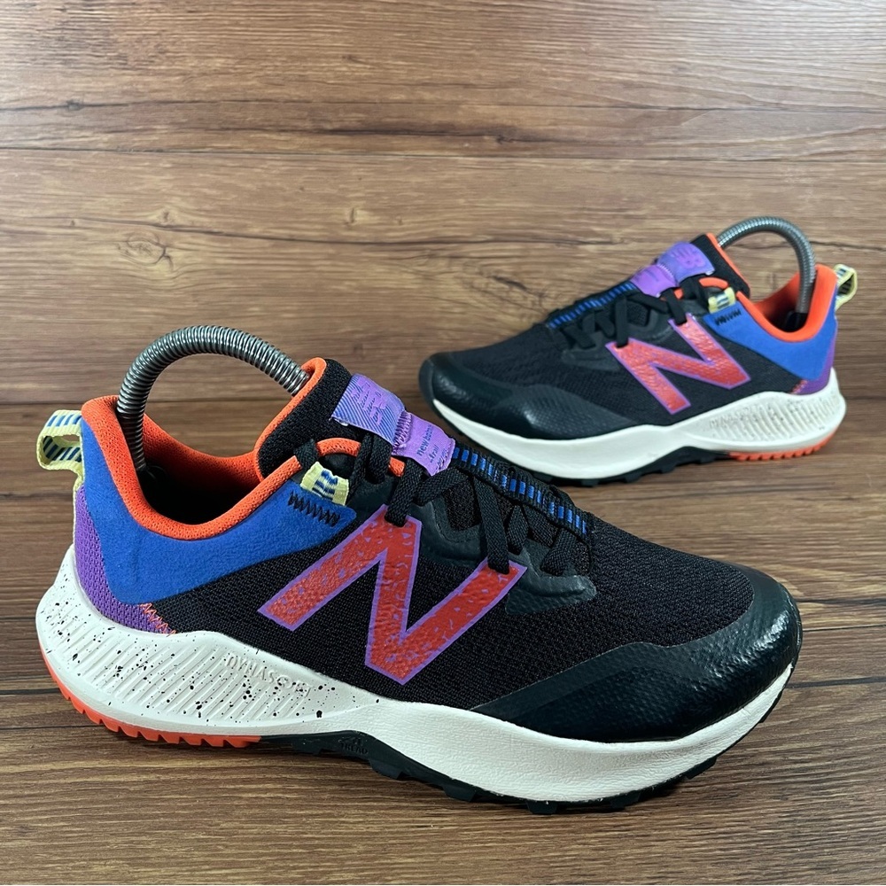 New Balance Black and Blue Sneakers with Red Accents
